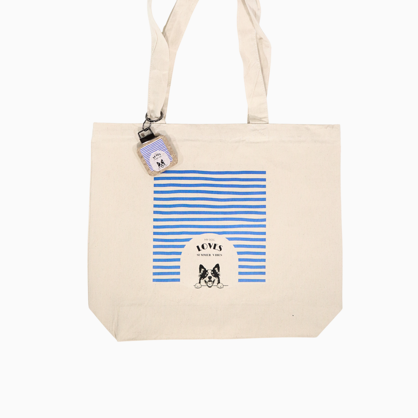 Beige tote bag with blue striped design and a customizable dog illustration on a white background