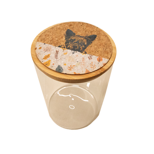 Glass jar with a cork lid featuring a dog illustration on a white background