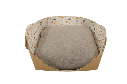 Cozy pet bed FALL FLUFF made of cork with raised sides and a soft beige cushion inside, designed for dogs and cats to sleep comfortably