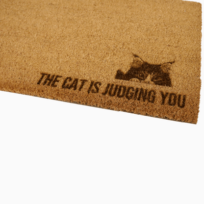 The Cat Is Judging You Doormat with breeds like Maine Coon and Persian, perfect for cat lovers