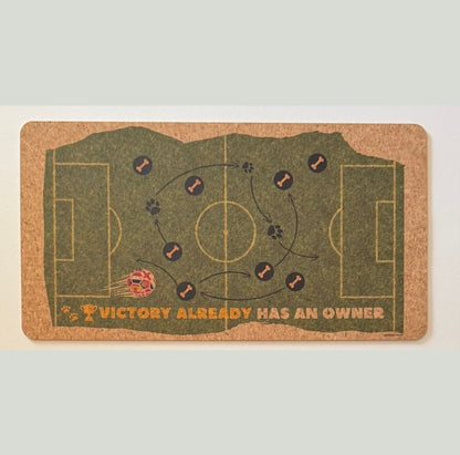 Decorative mat with soccer field design and text on a light gray background